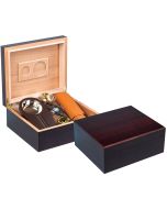 Two cherry wood humidors one is open showing a hygrometer, a double blade guillotine cutter, and a leather cigar case the other one is closed